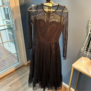 Wicked Weasel romper under a long sleeve fishnet dress